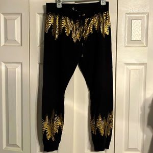 BEBE joggers black gold feathers size Large